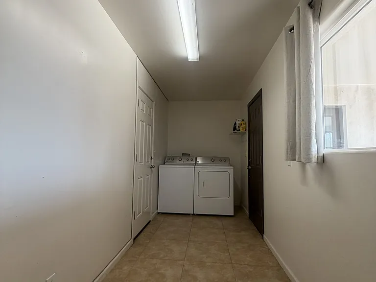 Laundry Room connecting to garage and backyard patio