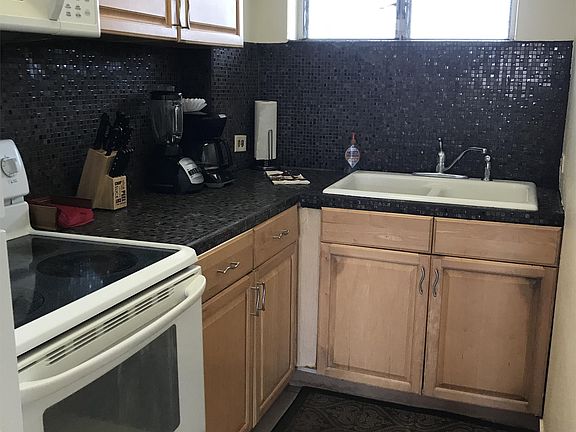 Kitchen fully stocked with cooking utensils