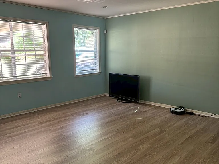 ___ Living Room
"Bright and spacious living area with new wood-look flooring and plenty of natural light. A cozy space to relax, gather, and entertain."