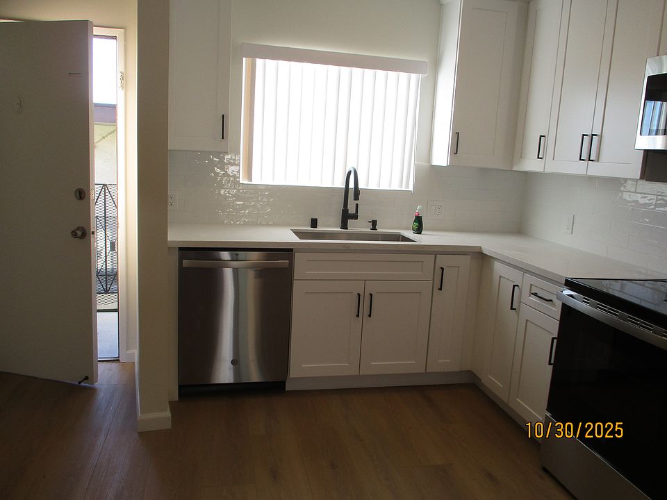 brand new stainless steel appliances including stove, dishwasher and microwave oven