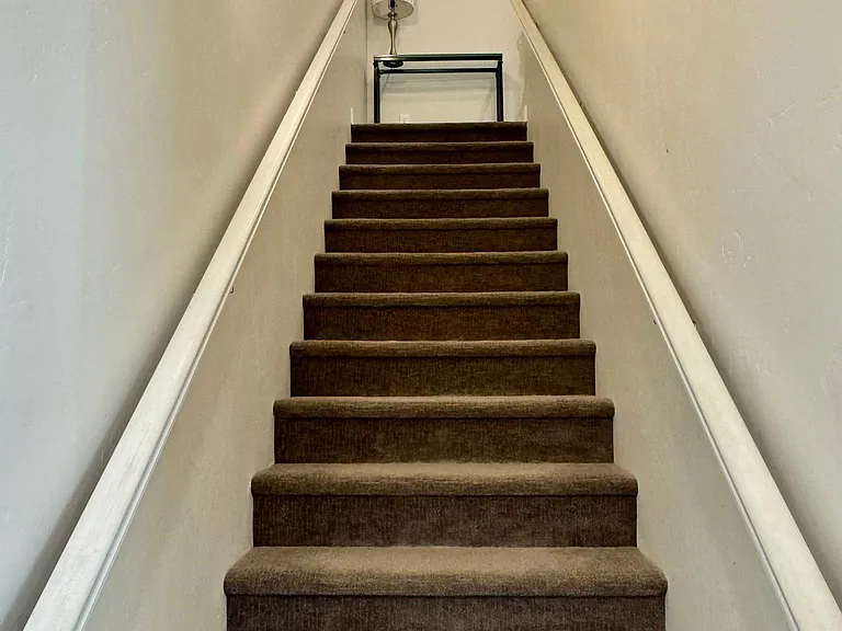 Entry way with stairs to second level bedrooms and to the right is the main living area.