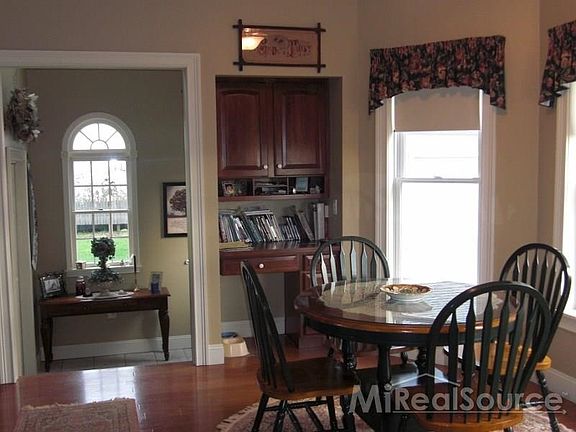 Beyond the breakfast nook is your foyer with the moon window which makes the room bright and sunny.