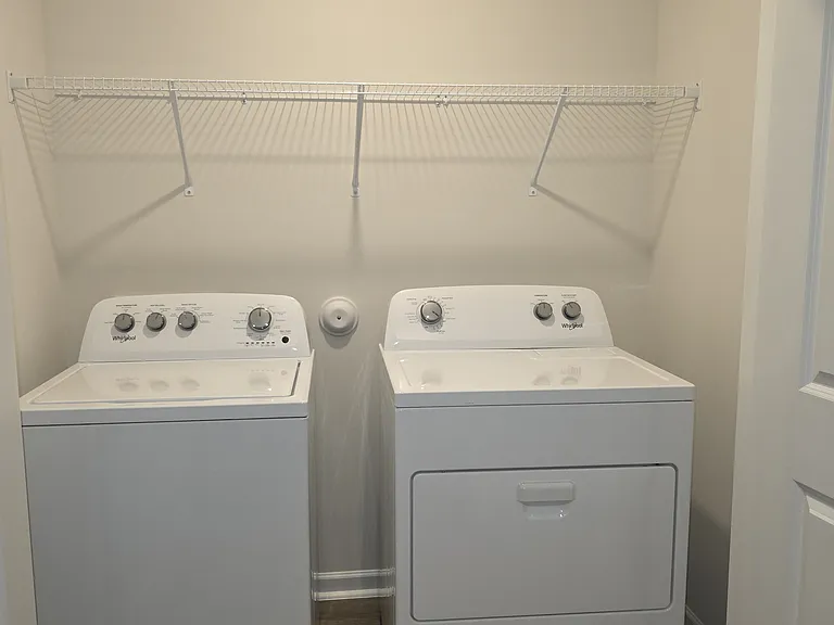 Laundry equiped with brand new washer and dryer set