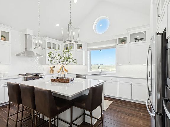 Kitchen with glass upper cabinets