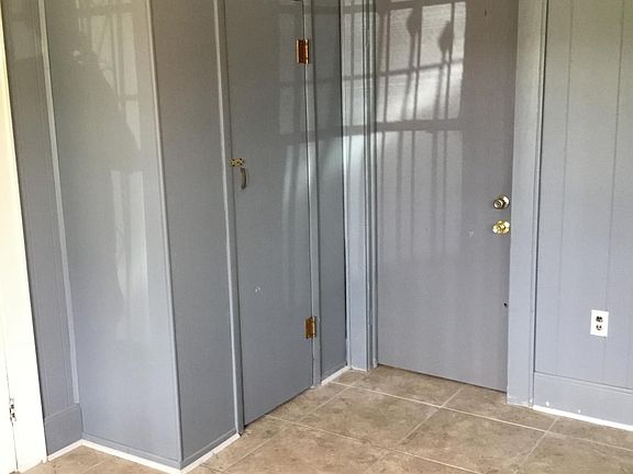 Front bedroom with door to bathroom/ ceramic tile floor