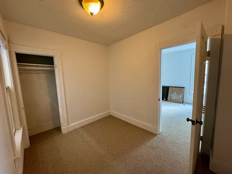 One of two small bedrooms.