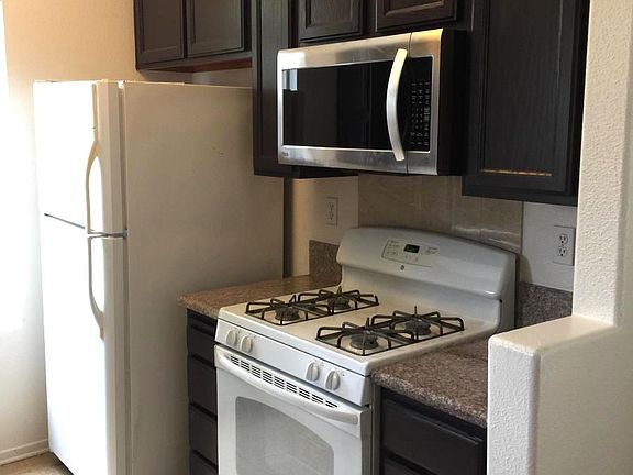 Neat kitchen with ample storage.
