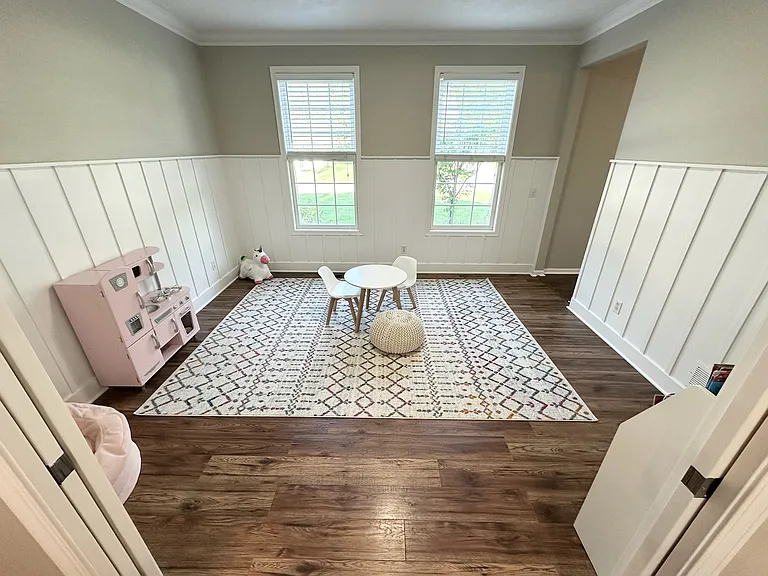 Main floor office / kids play area with pocket doors