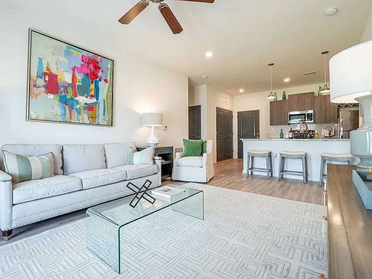 Open-concept living room with view of kitchen
