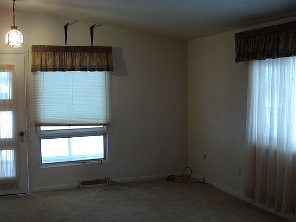 Family room leads to three season porch and deck
