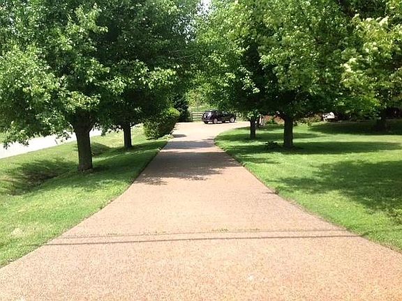 Tree lined driveway welcomes you home