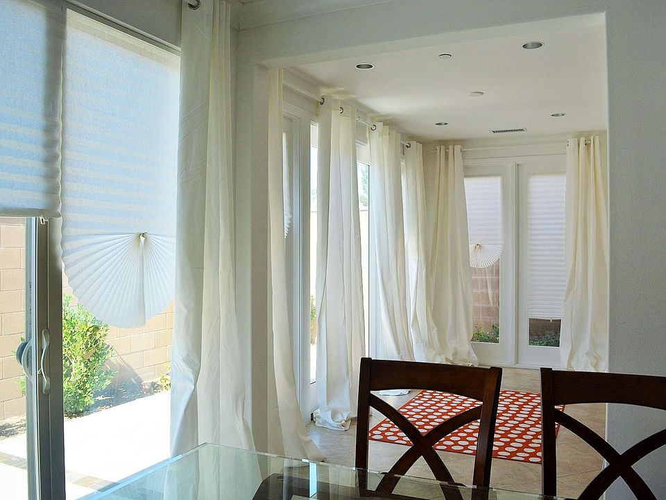 Sliding door at the dining room, and the conservatory room with french doors, and ceiling to floor window.