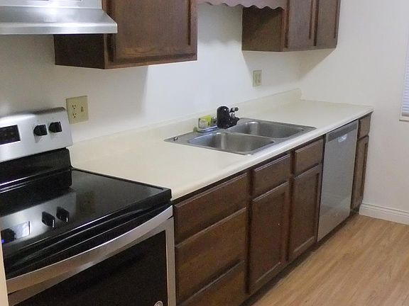 Kitchen with stainless steel appliances including dishwasher