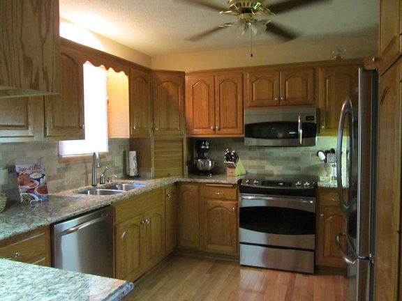 Brand New Appliances, Granite Counters, and Tile Backsplash