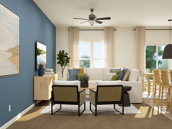 The living room has plenty of space for everyone to gather.