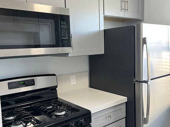 New appliances including refrigerator, microwave and stove.