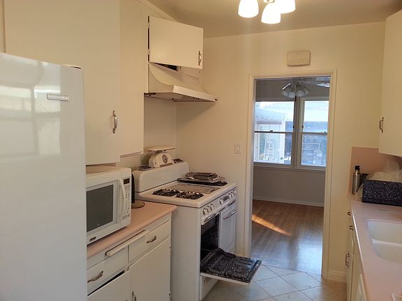 Kitchen with appliances and new tile floor