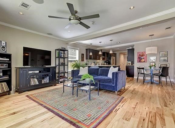 Nice features include crown molding, surround sound & recessed lighting on dimmers.