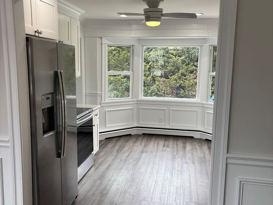 View from living room to Eat in kitchen appliance include SS refrigerator* stove/oven*build in microwave* dishwasher