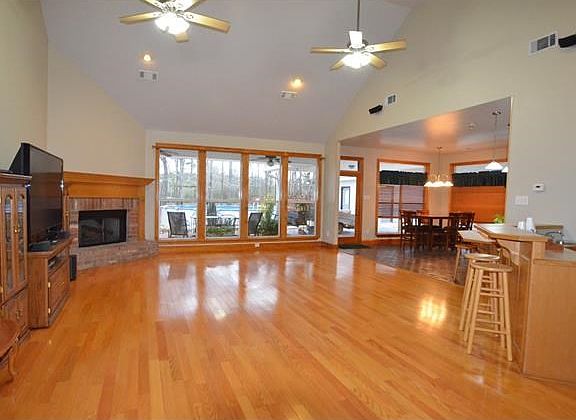 Family room with cathedral ceilings and open to kitchen area