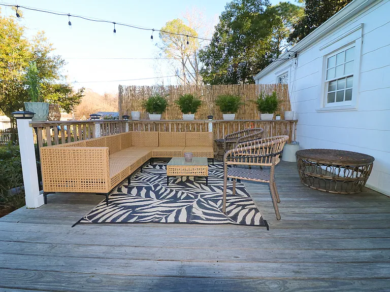 Back patio includes ample outdoor seating that can be enjoyed during every season