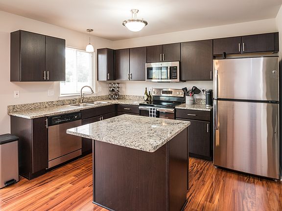 Spacious kitchen with granite counters and stainless appliances