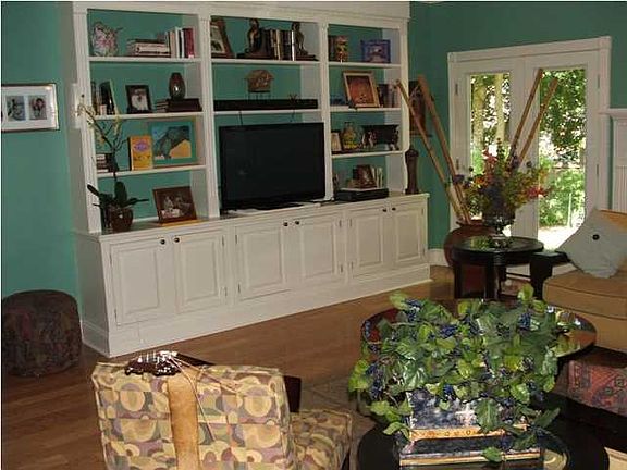 As you move from the entry foyer to the family room, you will be impressed with it's spacious size, double tray ceiling and french doors flanking the fireplace that lead to the relaxing backyard.