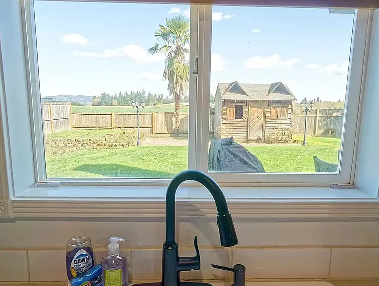 Kitchen, overlooking a large backyard