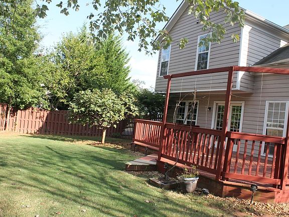 Deck and fenced-in, private backyard