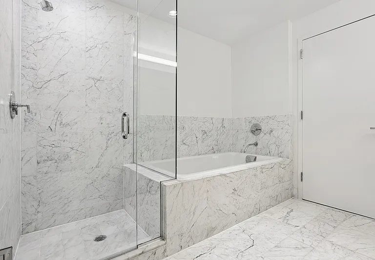 Unwind in the luxurious bathroom at Arbor, featuring elegant marble finishes and a spacious soaking tub. This serene oasis combines style and comfort, perfect for your daily routine. Schedule a tour today and envision your new life here!