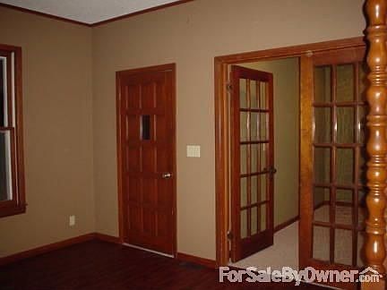 Dining room looking at stair case and doorway to kitchen.