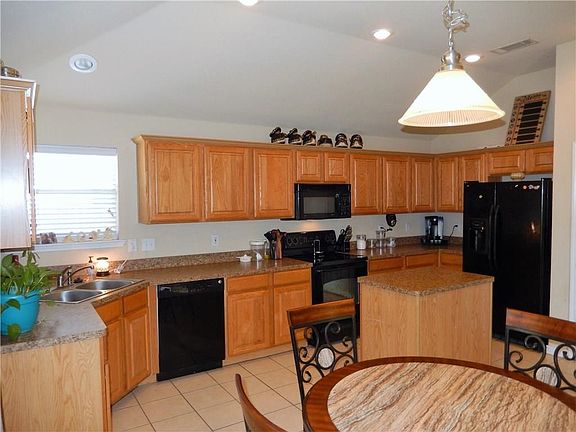 Kitchen offers plenty of cabinet space.