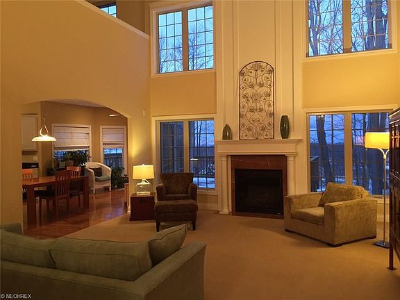 TWO STORY GREAT ROOM WITH FIREPLACE AND FULL WALL OF WINDOWS