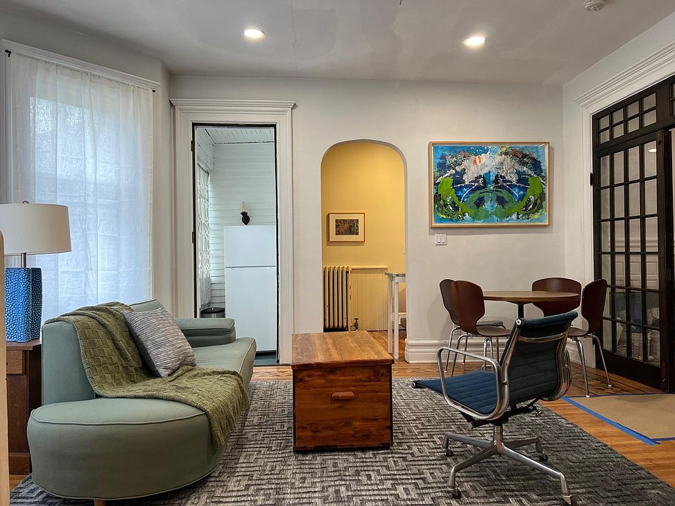 This is the living room and dining room. It connects to the front room, bedroom, and kitchen.