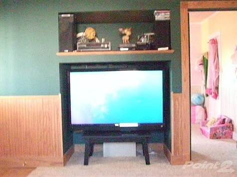Note that tv and shelf are recessed into the wall!