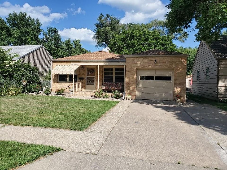 Lovely brick home with updated kitchen, finished basement, fenced back yard and attached garage with garage opener.