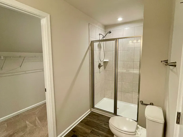 Full bath with glass shower and convenient handheld shower wand