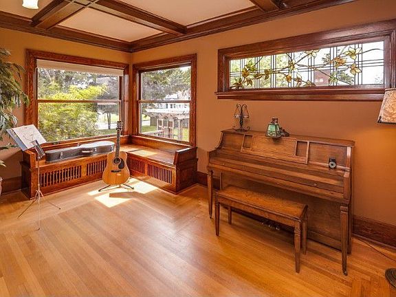 North end of the living room with great light and more built-ins/woodwork
