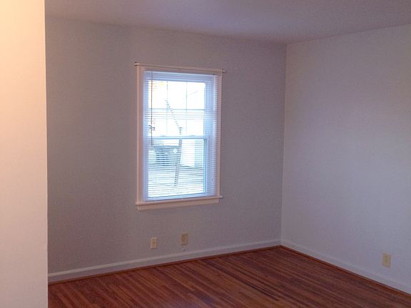living room: refinished wood floor