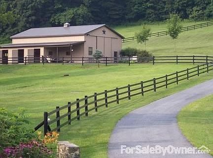 Entering driveway to barn
						:
						Barn is located on lower part of the lot. Two fenced pastures with auto waterer.