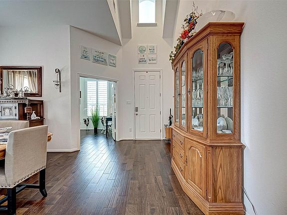 The beaming wood floors greet you as you come in to your beautiful home.