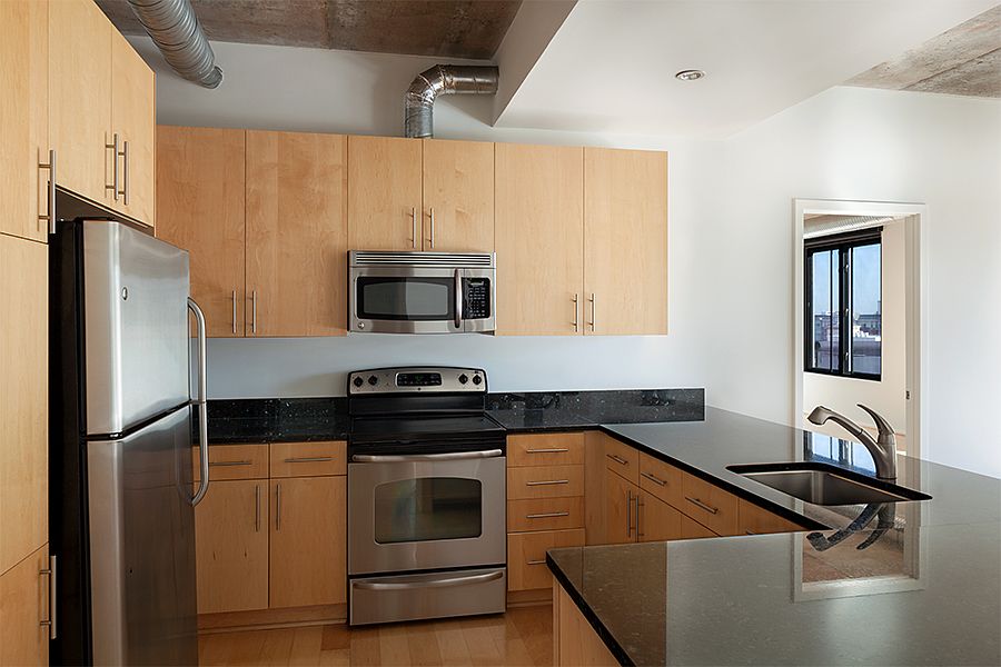 Granite countertops, stainless steel GE appliances, and 42" maple cabinetry