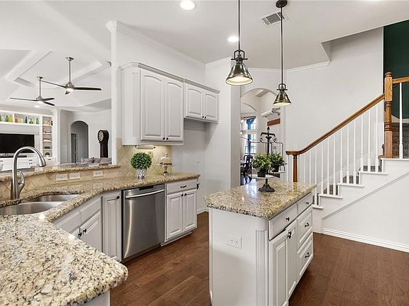Updated Kitchen with gorgeous newly painted cabinets, granite countertops and double ovens!