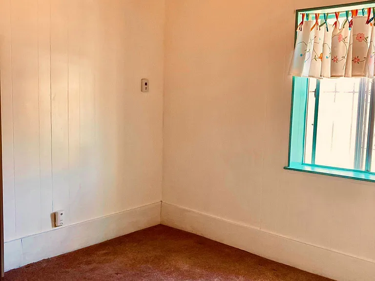 Bedroom with original Vegas, southside window and large walk-in closet