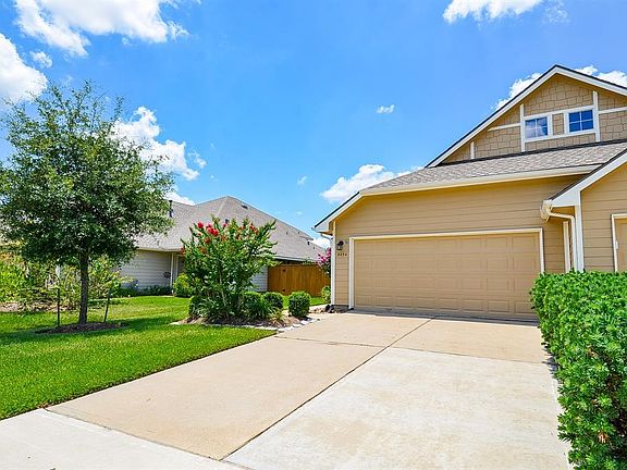 This extra long driveway will accommodate your visits from family and friends. Lush landscaping maintained by the monthly maintenance fee greets you with fantastic curb appeal. Enjoy the Crepe Myrtle's, Bottle Brush and green space as you walk up to 