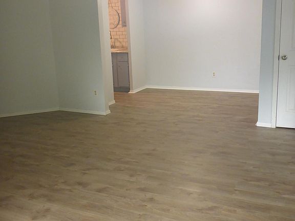 View of dining room and kitchen from corner of living room.