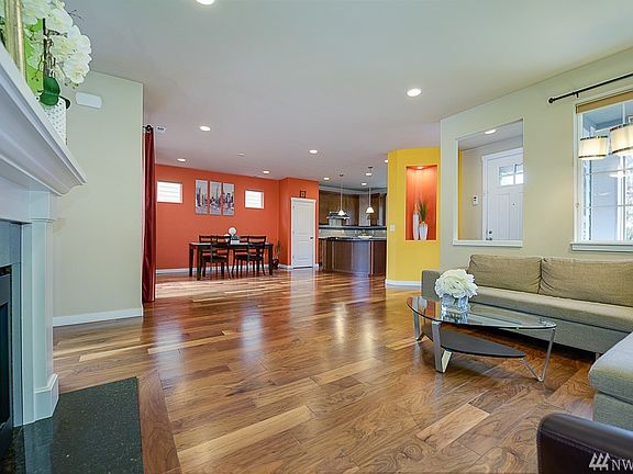 Open floor plan with wide plank flooring throughout main