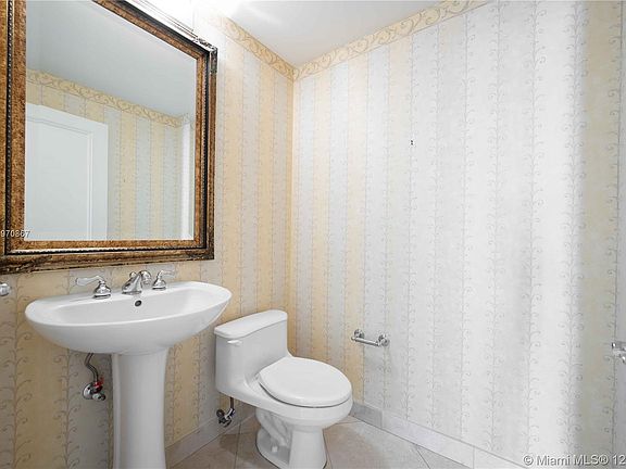 Powder room located at front of condo.