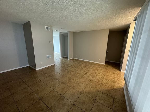 Spacious living room with tile floors