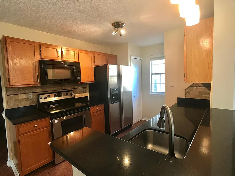 Stainless steel appliances and granite countertops kitchen